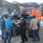 Deputy Marty Johnson assists volunteers preparing to ascend Mt. Princeton trail